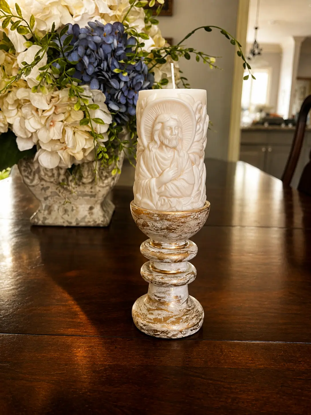 Ivory Sacred Heart pillar candle displayed on a white and gold pedestal